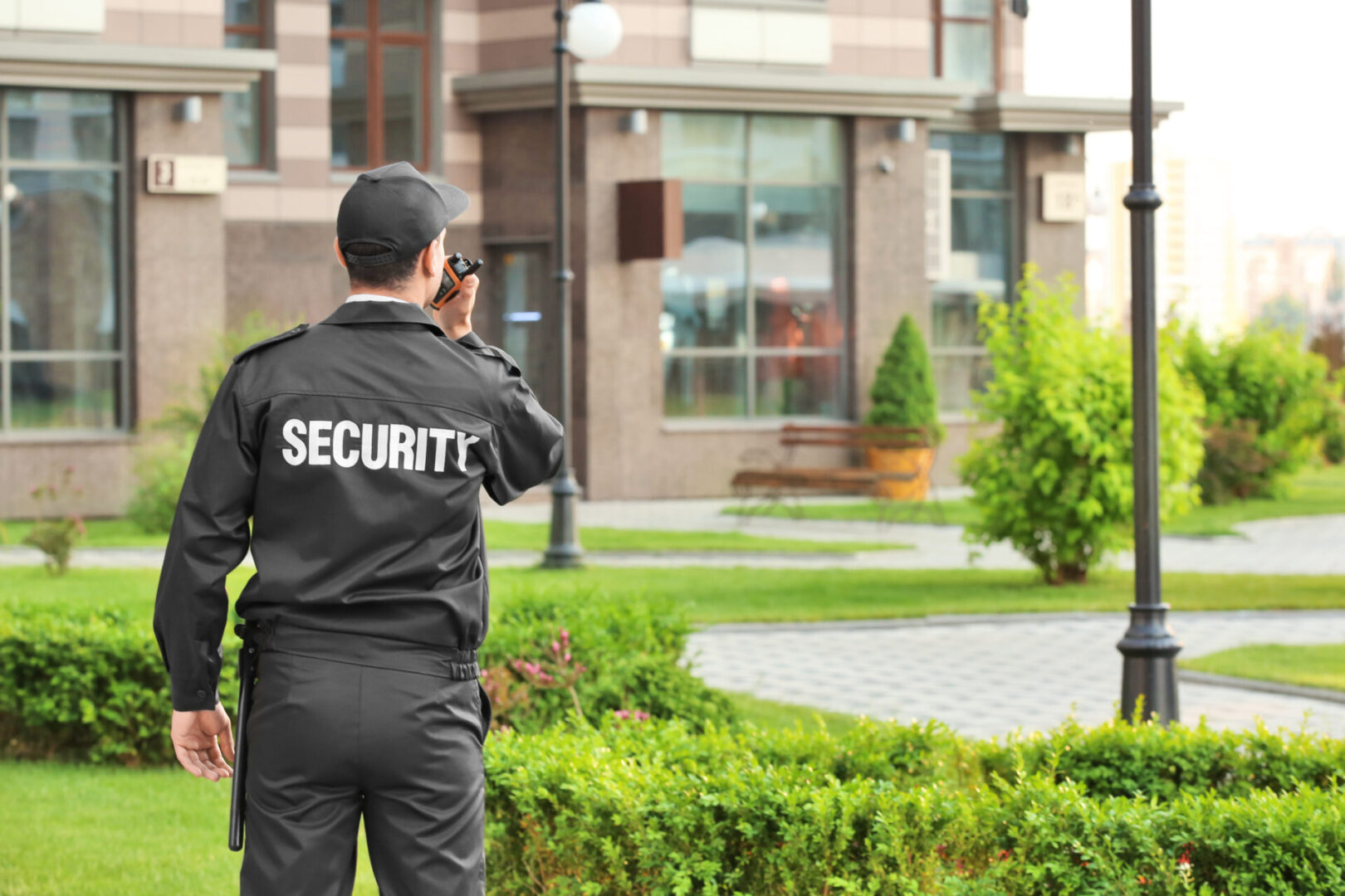 A security guard standing in front of a building.